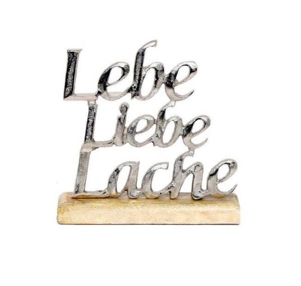 Schriftzug 'Lebe Liebe Lache' aus Aluminium auf Holzfuß
